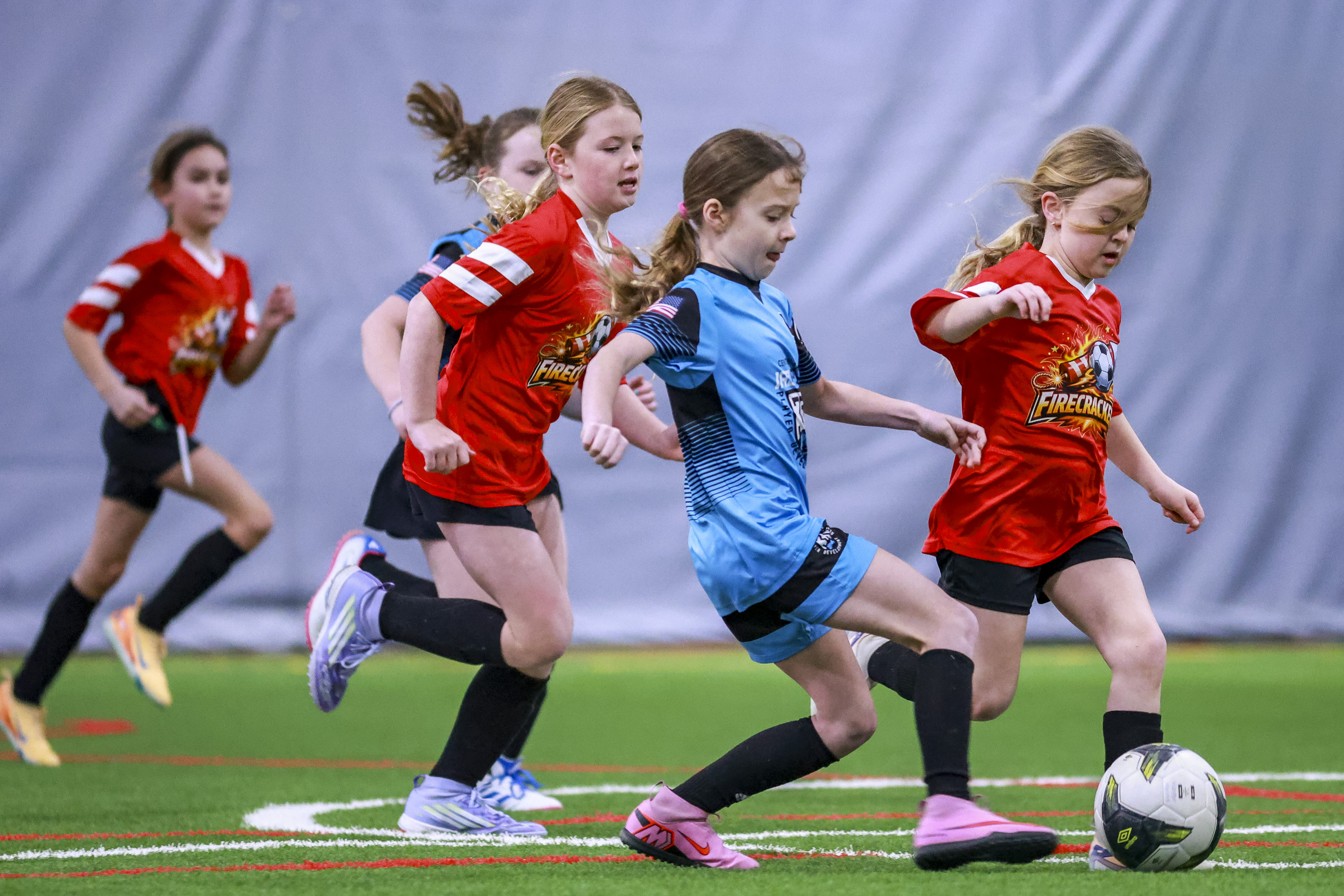 Youth players and a coach at LSC Indoor