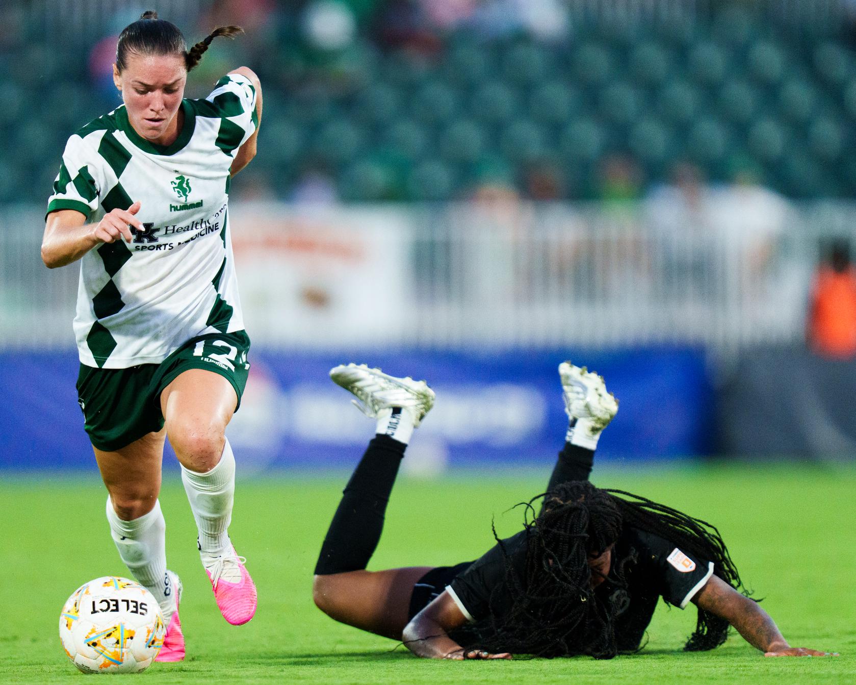 LSC player on the run with the ball against Brooklyn FC