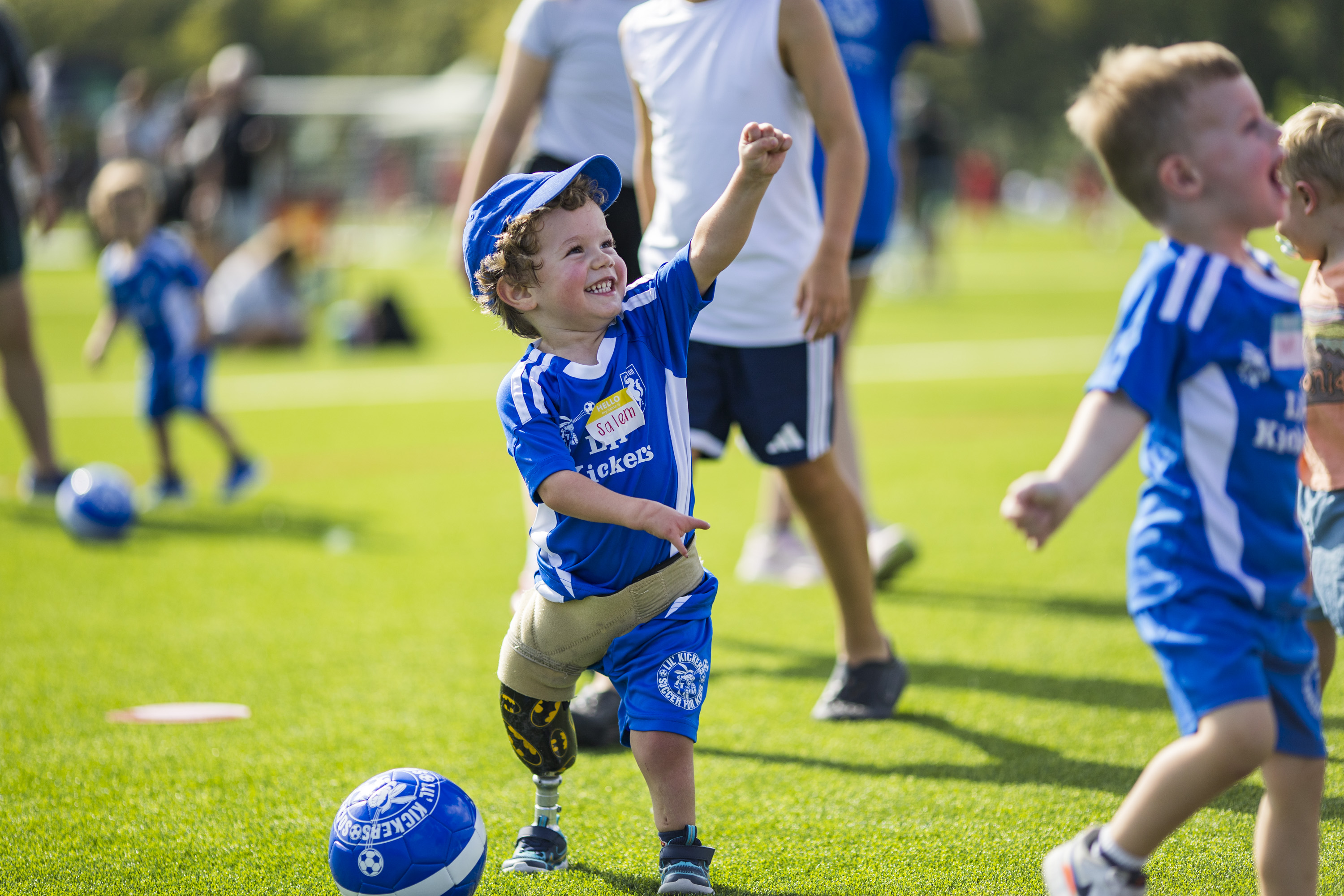 Lil' Kicker celebrating with arm raised